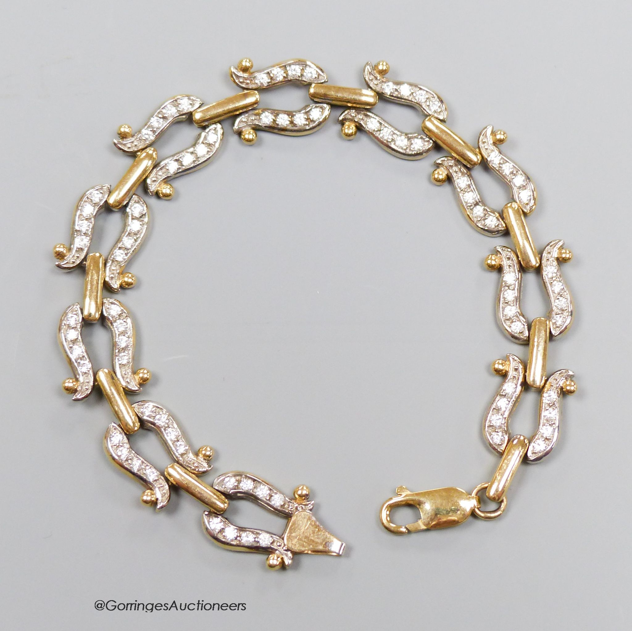 A 9ct gold and paste bracelet, with stylised horseshoe links, gross 19.9g, 19cm.